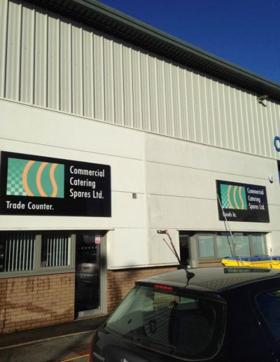 UCS cladding cleaning 2 Picture showing half a building clean and half the building unclean as a member of staff is halfway through cleaning the cladding on a commercial unit