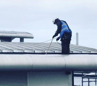 UCS commercial gutter cleaningIMG_2587 (002) Picture of a Ultra Cleaning Service employee cleaning an industrial gutter. INtroducing Ultra Cleaning Services gutter cleaning