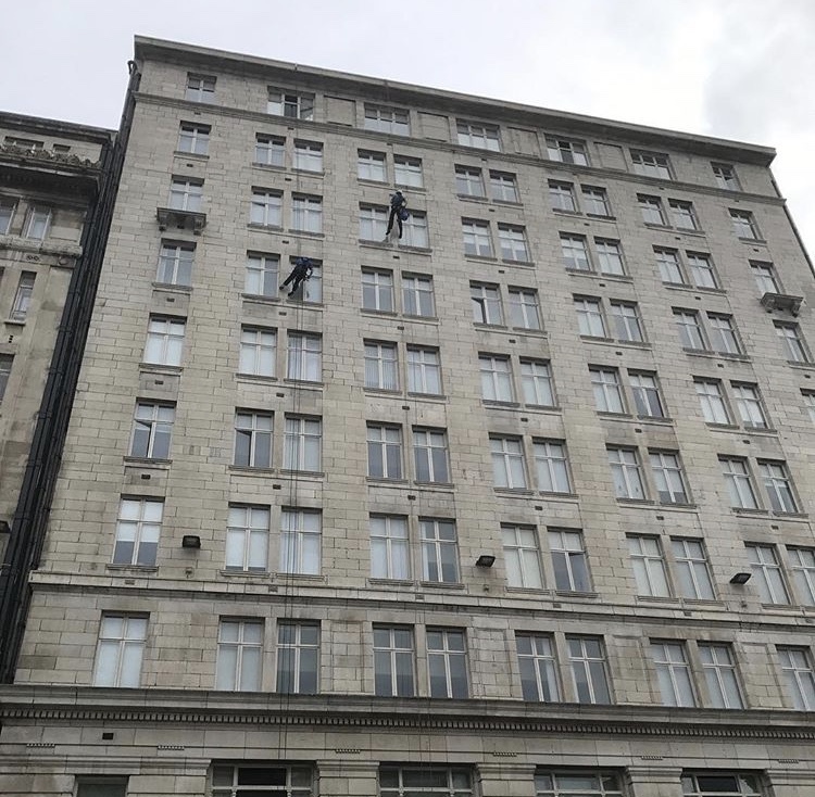 UCSIMG_2923.jpg Abseilers on a older looking building